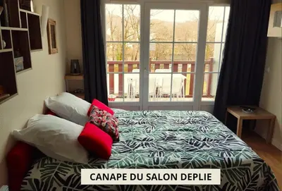 Un ou plusieurs lits dans un hébergement de l'établissement Appartement vue riviere