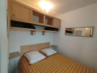 Un ou plusieurs lits dans un hébergement de l'établissement Appartement vue riviere