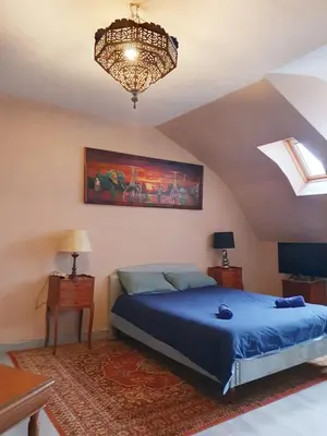 Un ou plusieurs lits dans un hébergement de l'établissement Appartement d'Artiste