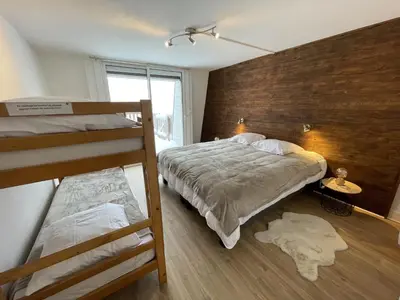 Un ou plusieurs lits dans un hébergement de l'établissement Chaleureux appartement Altitude 1500