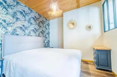 Un ou plusieurs lits dans un hébergement de l'établissement Deux Chambres Pleines de Charme - 2 Chambres
