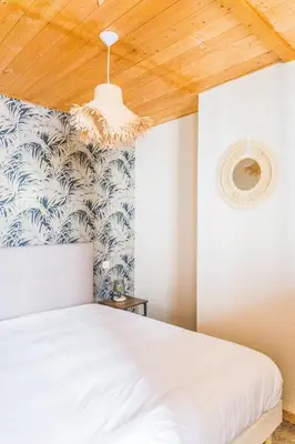 Un ou plusieurs lits dans un hébergement de l'établissement Deux Chambres Pleines de Charme - 2 Chambres