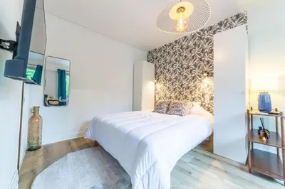 Un ou plusieurs lits dans un hébergement de l'établissement L Ecrin de la Guierle - 1 Chambre