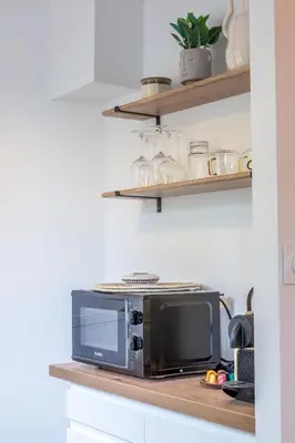 Cuisine ou kitchenette dans l'établissement L Ecrin de la Guierle - 1 Chambre