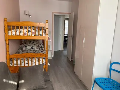Un ou plusieurs lits dans un hébergement de l'établissement Appartement spacieux au centre de La Bourboule - FR-1-858-11