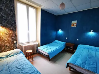 Un ou plusieurs lits dans un hébergement de l'établissement Appartement pour 6 à La Bourboule avec WiFi - FR-1-858-12