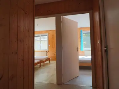 Un ou plusieurs lits dans un hébergement de l'établissement Charmante maison familiale à La Bourboule - FR-1-858-15