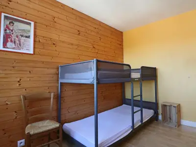 Un ou plusieurs lits dans un hébergement de l'établissement Charmante maison familiale à La Bourboule - FR-1-858-15