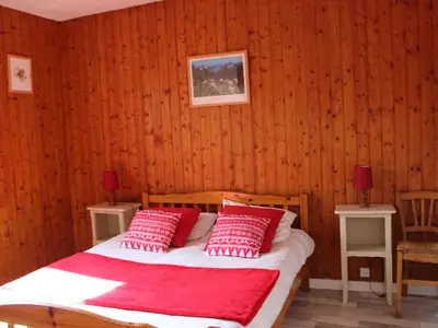Un ou plusieurs lits dans un hébergement de l'établissement Appartement cosy 2 chambres au Mont-Dore, animaux admis - FR-1-858-24
