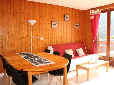 Coin salon dans l'établissement Appartement cosy 2 chambres au Mont-Dore, animaux admis - FR-1-858-24