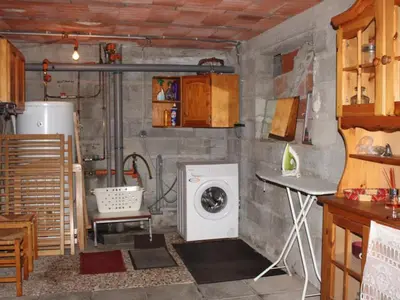 Cuisine ou kitchenette dans l'établissement Appartement cosy 2 chambres au Mont-Dore, animaux admis - FR-1-858-24