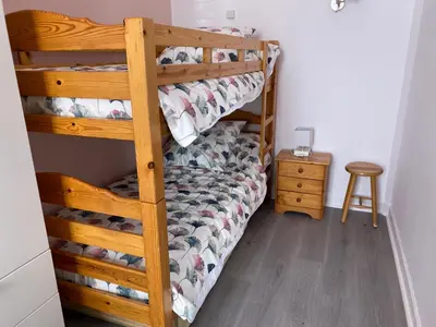 Un ou plusieurs lits dans un hébergement de l'établissement Appartement 6 personnes au cœur de La Bourboule - FR-1-858-23