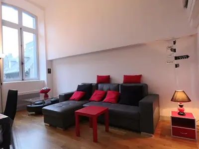 Coin salon dans l'établissement Loft lumineux en centre-ville, proche thermes, pour 4 personnes - FR-1-858-28