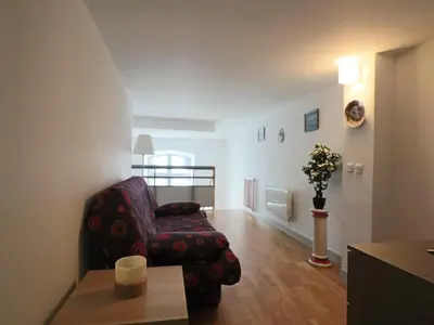 Coin salon dans l'établissement Duplex cosy au cœur de La Bourboule, jusqu'à 6 personnes - FR-1-858-32