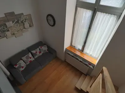 Coin salon dans l'établissement Duplex cosy au cœur de La Bourboule, jusqu'à 6 personnes - FR-1-858-32