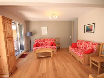 Coin salon dans l'établissement Chalet Montagne avec Terrasse et Parking - FR-1-858-29
