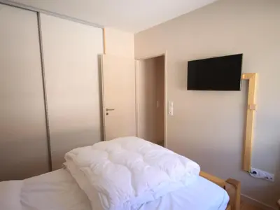 Un ou plusieurs lits dans un hébergement de l'établissement Chalet Montagne avec Terrasse et Parking - FR-1-858-29