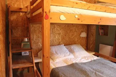 Un ou plusieurs lits dans un hébergement de l'établissement Chouette Bourboule 2 chambres, 6 pers, terrasse