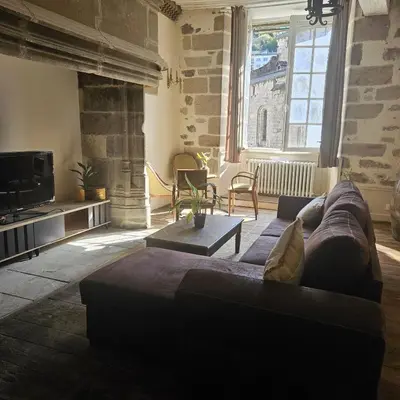 Coin salon dans l'établissement Gite Maison Loyac