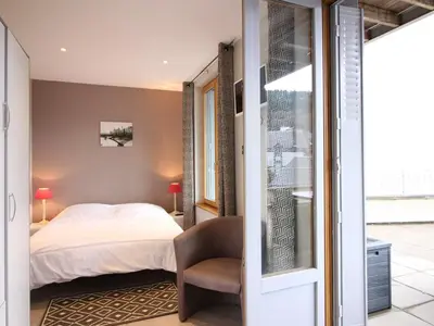 Un ou plusieurs lits dans un hébergement de l'établissement Bel F3 au Mont-Dore avec terrasse, parking et wifi - FR-1-415-160