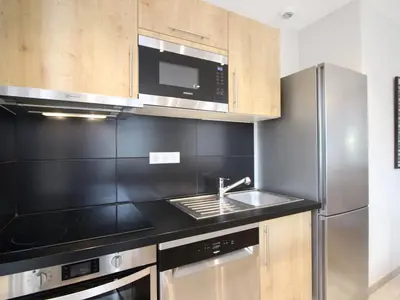 Cuisine ou kitchenette dans l'établissement Bel F3 au Mont-Dore avec terrasse, parking et wifi - FR-1-415-160