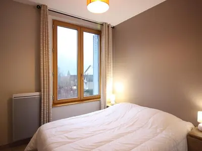 Un ou plusieurs lits dans un hébergement de l'établissement F2 confortable avec wifi et parking privé, proche thermes - FR-1-415-161