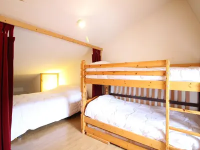 Un ou plusieurs lits dans un hébergement de l'établissement Duplex F2 au Mont-Dore avec Garage Privé - FR-1-415-167