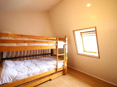 Un ou plusieurs lits dans un hébergement de l'établissement Duplex F2 au Mont-Dore avec Garage Privé - FR-1-415-167
