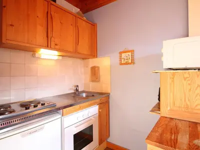 Cuisine ou kitchenette dans l'établissement Duplex F2 au Mont-Dore avec Garage Privé - FR-1-415-167