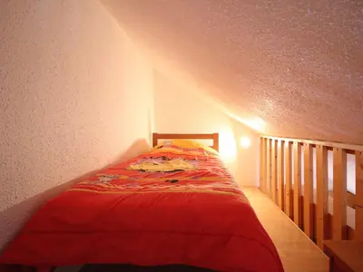 Un ou plusieurs lits dans un hébergement de l'établissement Appartement F2 Bis Près des Pistes Pour 5 Personnes - FR-1-415-172