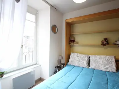 Un ou plusieurs lits dans un hébergement de l'établissement Appartement centre Mont-Dore, 4 personnes, ascenseur - FR-1-415-184