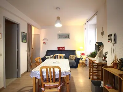 Coin salon dans l'établissement Appartement centre Mont-Dore, 4 personnes, ascenseur - FR-1-415-184