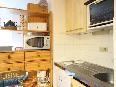 Cuisine ou kitchenette dans l'établissement Appartement centre Mont-Dore, 4 personnes, ascenseur - FR-1-415-184