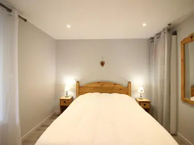 Un ou plusieurs lits dans un hébergement de l'établissement Appartement T2 de charme au Mont-Dore avec parking et wifi - FR-1-415-176