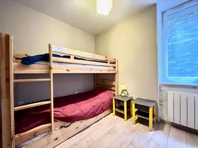 Un ou plusieurs lits dans un hébergement de l'établissement Appartement F3 WiFi au Mont-Dore, proche centre et thermes - FR-1-415-183
