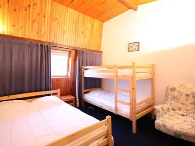 Un ou plusieurs lits dans un hébergement de l'établissement Duplex spacieux au Mont-Dore avec parking privé - FR-1-415-177