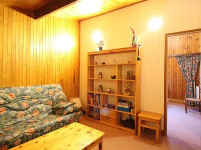 Coin salon dans l'établissement Duplex spacieux au Mont-Dore avec parking privé - FR-1-415-177