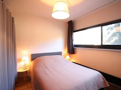 Un ou plusieurs lits dans un hébergement de l'établissement Appartement F2 avec parking, proche commodités et thermes - FR-1-415-179