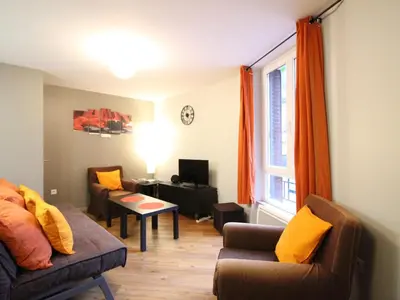 Coin salon dans l'établissement Bel appartement F3, 7 couchages, proche des Thermes du Mont Dore - FR-1-415-190