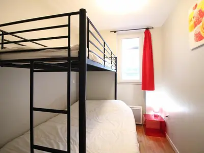 Un ou plusieurs lits dans un hébergement de l'établissement Bel appartement F3, 7 couchages, proche des Thermes du Mont Dore - FR-1-415-190
