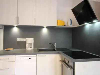 Cuisine ou kitchenette dans l'établissement Appartement F2 bis de 50m² au centre, 4 pers., animaux admis, WiFi - FR-1-415-178
