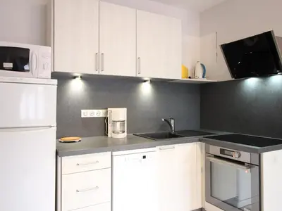 Cuisine ou kitchenette dans l'établissement Appartement F2 bis de 50m² au centre, 4 pers., animaux admis, WiFi - FR-1-415-178