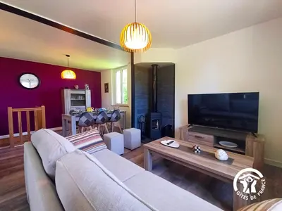 Télévision ou salle de divertissement dans l'établissement La Maison d'à côté
