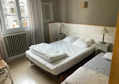Un ou plusieurs lits dans un hébergement de l'établissement Agréable appartement au coeur du Mont-dore