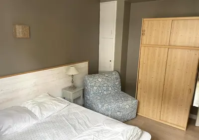 Un ou plusieurs lits dans un hébergement de l'établissement Agréable appartement au coeur du Mont-dore