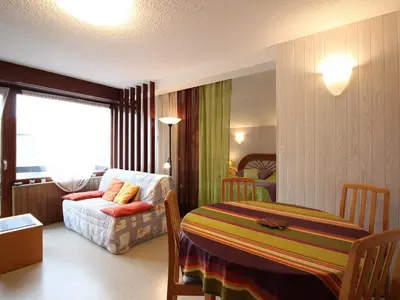 Un ou plusieurs lits dans un hébergement de l'établissement Mont-Dore: T2 bis avec balcon et parking proche centre - FR-1-415-205