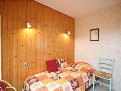Un ou plusieurs lits dans un hébergement de l'établissement Mont-Dore: T2 bis avec balcon et parking proche centre - FR-1-415-205
