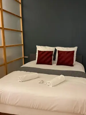 Un ou plusieurs lits dans un hébergement de l'établissement Appartement 4 spacieux Av Georges Dumas - DABNB