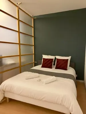 Un ou plusieurs lits dans un hébergement de l'établissement Appartement 4 spacieux Av Georges Dumas - DABNB