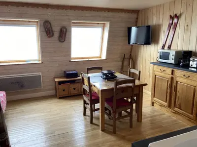 Cuisine ou kitchenette dans l'établissement Studio montagne